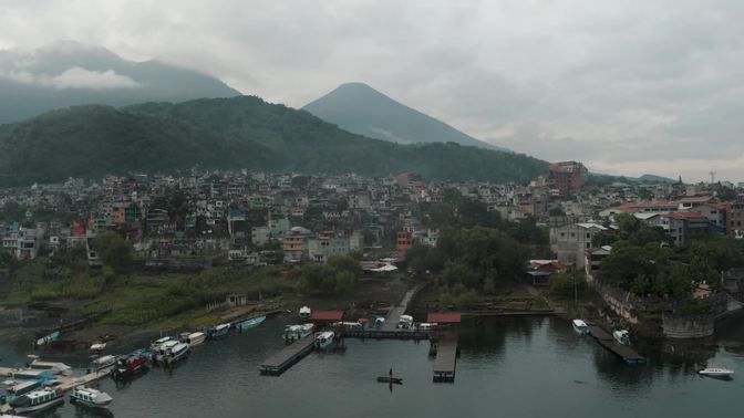 Sailboats At The Harbour Of Lake Atitlan With A View Of The Volcanoes In Guatemala. Aerial	
