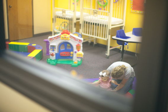 Looking Through A Window Into A Church Nursery 